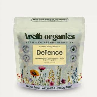 welb organics Healer herbal tea package with floral design on a light gray background