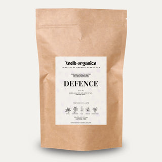 Brown paper bag with a label for 'Defence' tea on a white background