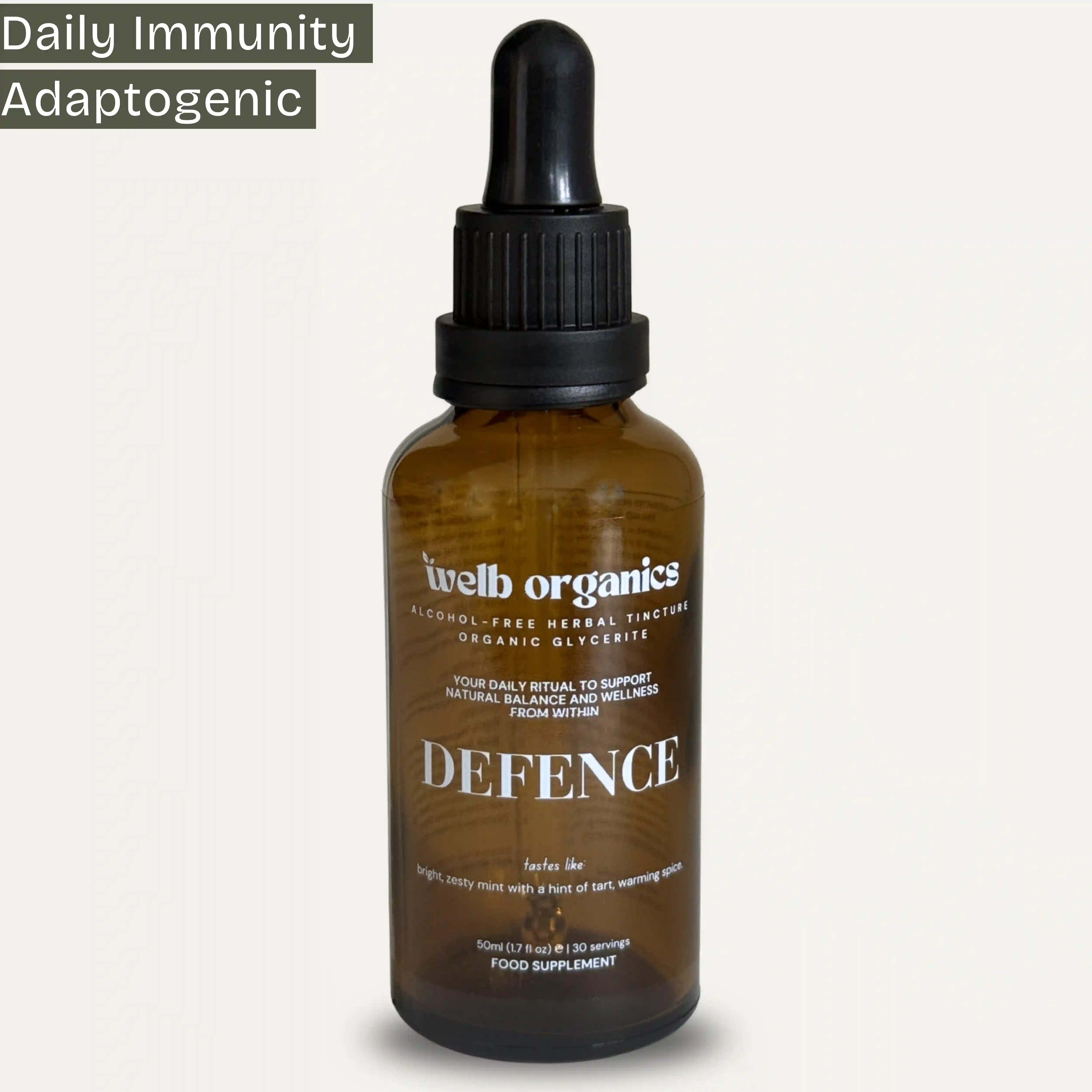 Brown bottle with dropper labeled 'welb organics Defence' on a white background