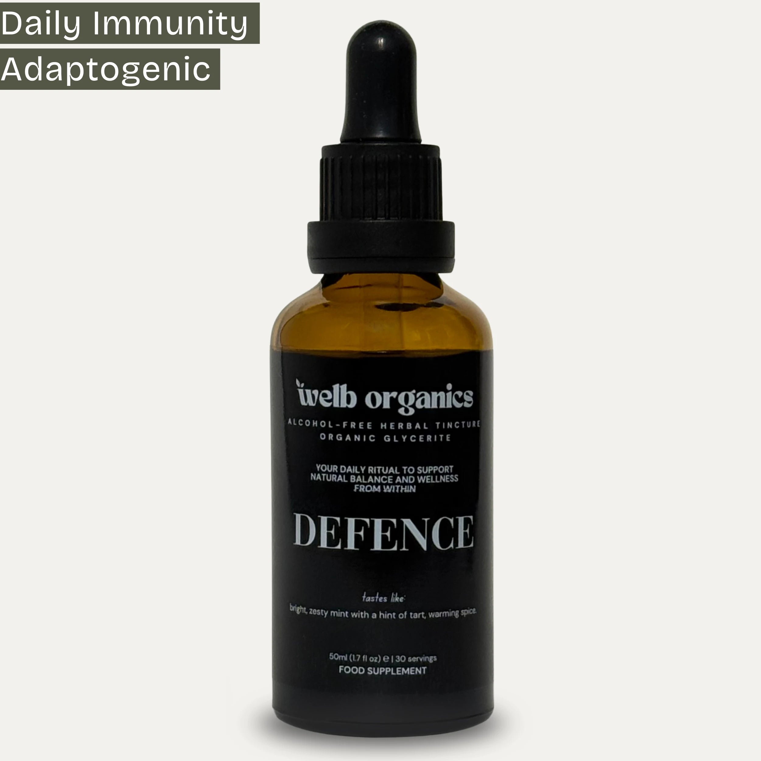 A 50ml amber glass dropper bottle of welb organics Defence adaptogenic herbal tincture, shown against a light grey background with a dark green text banner in the top left corner.
