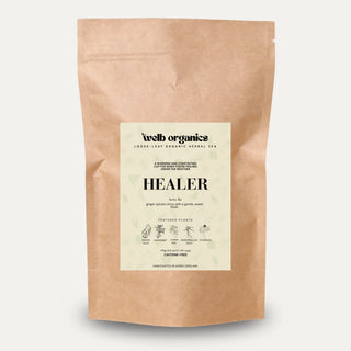 Kraft paper tea bag with 'Healer' label on a light gray background