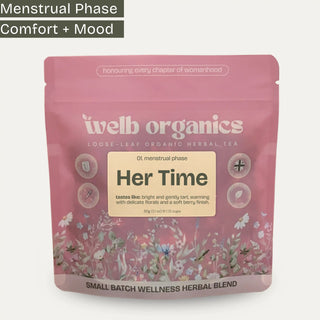 Welb Organics 'Her Time' loose-leaf herbal tea in a pink resealable pouch with floral illustrations and a cream label, shown on a light gray background with a text banner at the top.