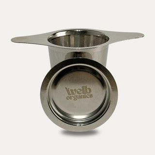 Stainless steel tea steeper on a neutral background