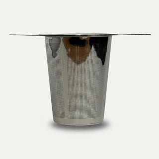 Stainless steel tea steeper on a neutral background