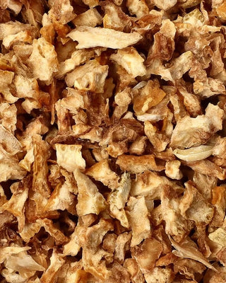 Close-up of dried lemon peels with brown and beige colors.