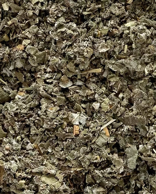 Close-up of dried raspberry leave herbs  with a textured surface