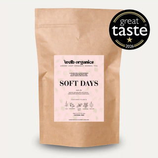 A kraft paper stand-up pouch of Welb Organics Soft Days herbal tea with a light pink label, shown on a light gray background with a black 'great taste 2026' badge in the top right corner.